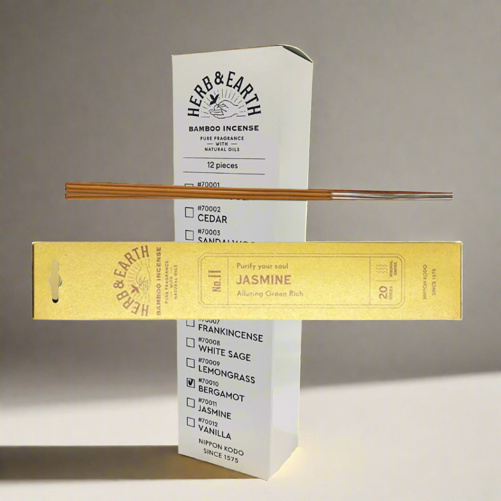 Herb & Earth bamboo incense packaging with incense sticks on a white background
