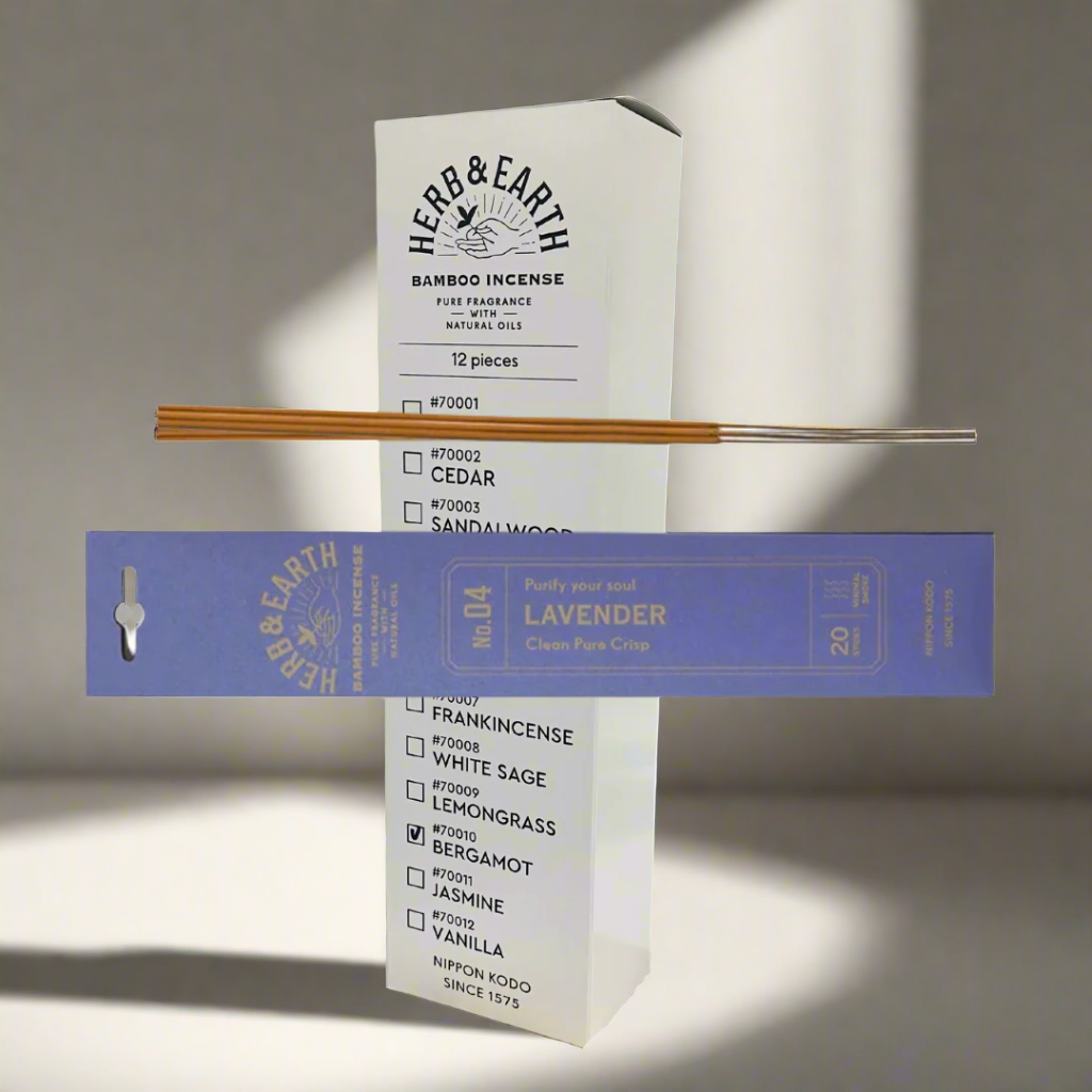 Herb & Earth bamboo incense packaging with incense sticks on a white background