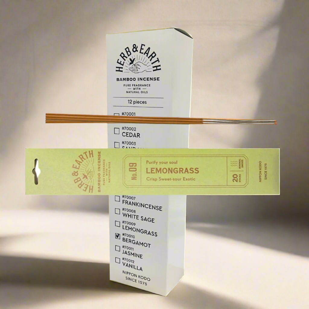 Herb & Earth bamboo incense packaging with incense sticks on a white background