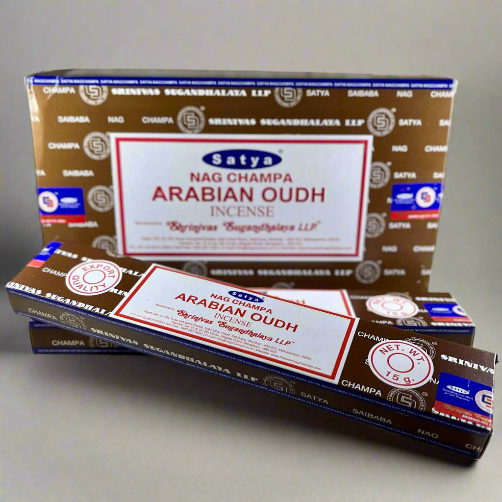 Satya Nag Champa Arabian Oudh incense packaging on a textured surface