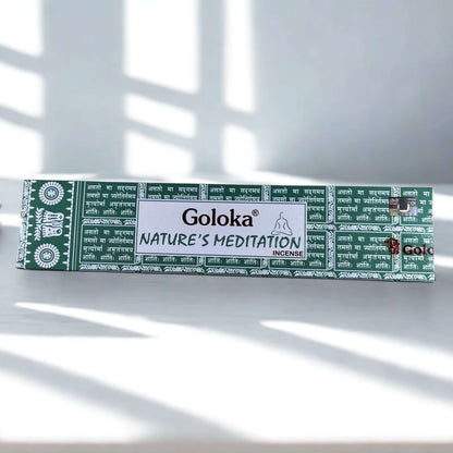 Box of Goloka Nature's Meditation incense on a white surface with sunlight casting shadows.