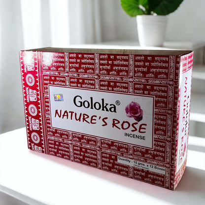 Box of Goloka Nature's Rose incense on a white surface with a plant in the background
