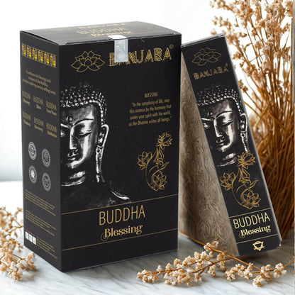 Buddha-themed incense packaging with decorative elements on a neutral background