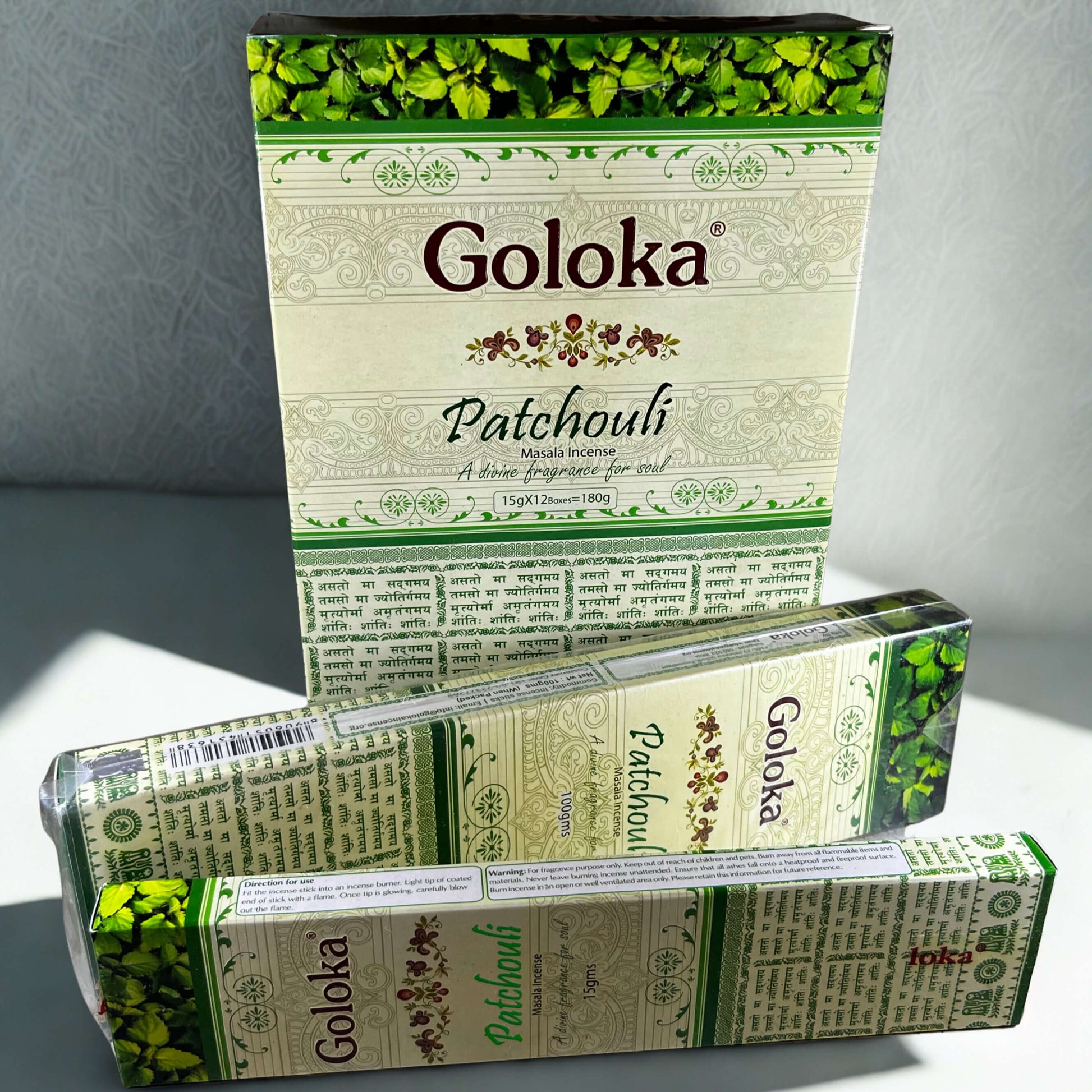 Goloka Patchouli incense packaging on a gray background