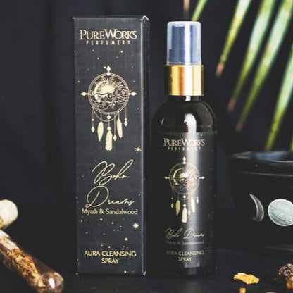 Pure Works perfume bottle and packaging with decorative items on a dark background