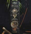 Packaged incense sticks with decorative design on a dark background