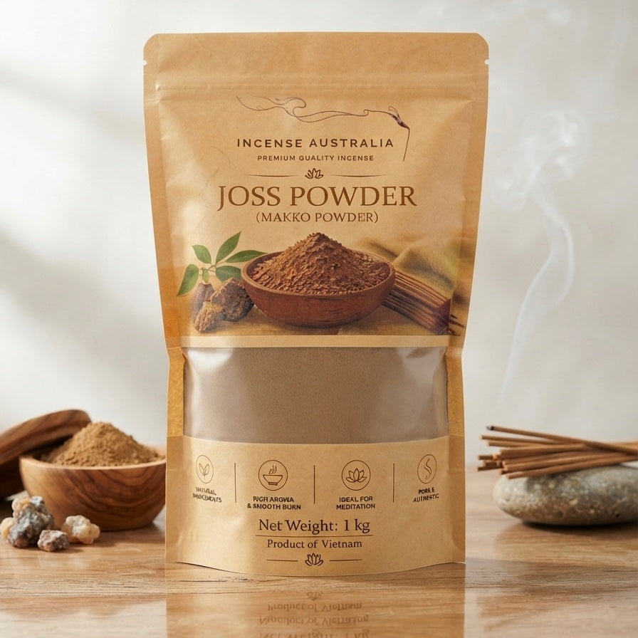 A 1 kg stand-up pouch of Joss Powder (Makko Powder) by Incense Australia, displayed on a wooden surface with incense sticks and bowls of powder in the background.