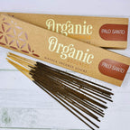A packet of Organic Goodness Palo Santo incense sticks displayed on a wooden surface.