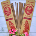 A packet of incense sticks branded 'WAYANG' with natural floral incense, displayed with pink flowers in the foreground.