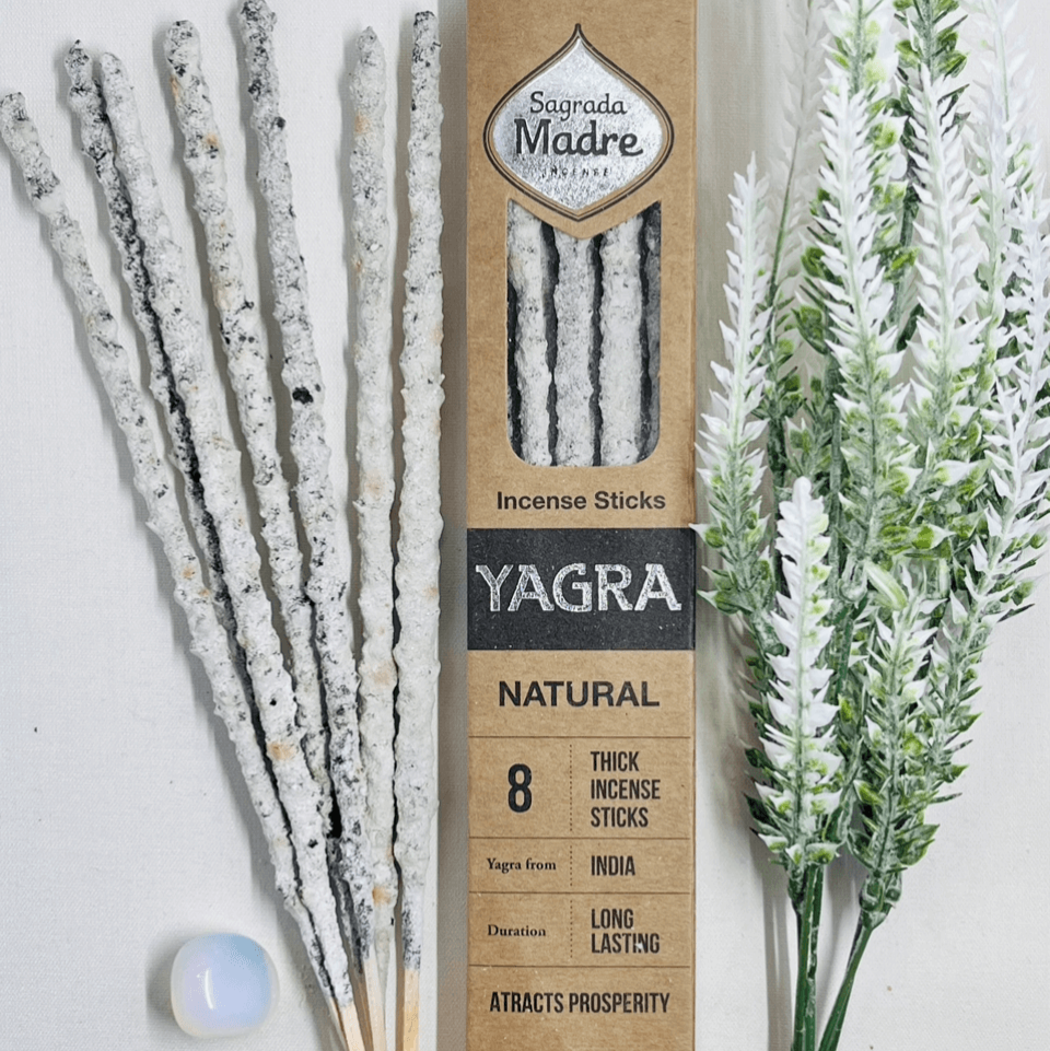 A box of Sagrada Madre natural incense sticks with 'YAGRA' written on it, alongside a bundle of dried incense leaves and a small container of incense powder.