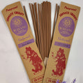A packet of Balinese Orchid incense with 20 sticks, displayed alongside flowers and a label that indicates 'Wayang' and 'Natural Orchid 2015'.