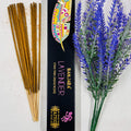 A packet of Banjara Aztec incense sticks with lavender color displayed next to a sprig of lavender.