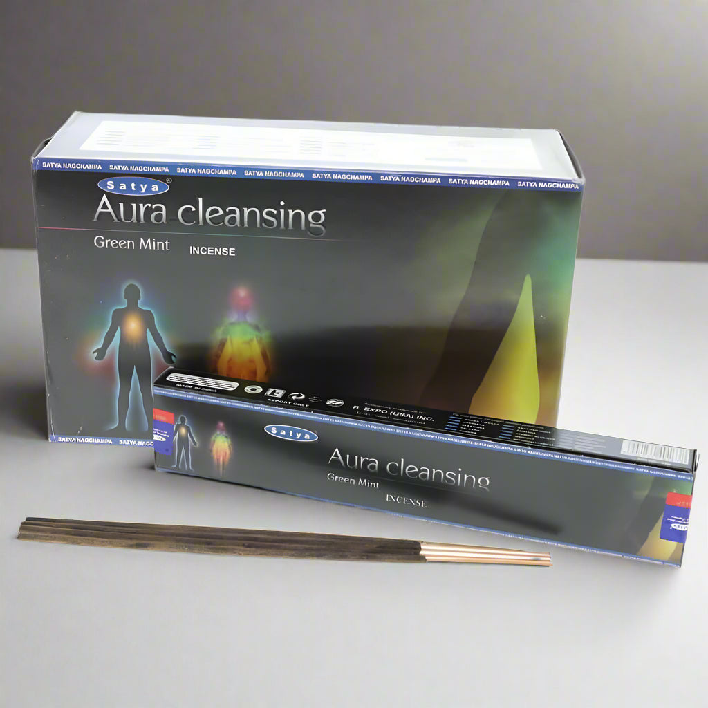 Satya Aura cleansing incense packaging with incense sticks on a neutral background