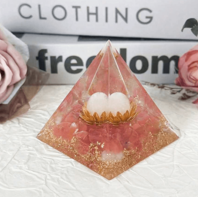 Pyramid-shaped decorative item with eggs on a textured surface with 'Clothing Freedom' text in the background.