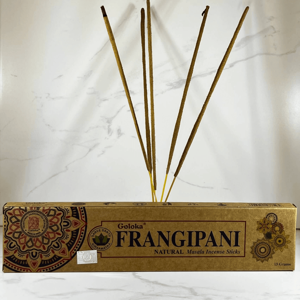 A box of Goloka Frangipani natural incense sticks displayed against a marble background.
