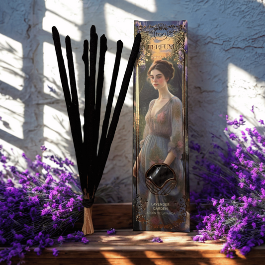 Lavender-themed product packaging with black feathers and lavender flowers on a textured wall background