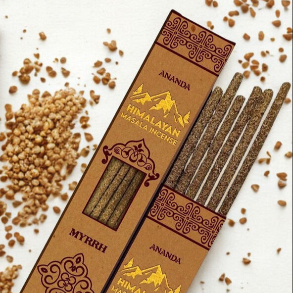 Himalayan Masala Incense packaging with incense sticks and ash on a white background