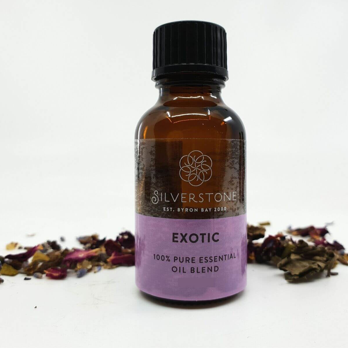 Bottle of Silverstone Exotic 100% pure essential oil blend with dried herbs on a white background