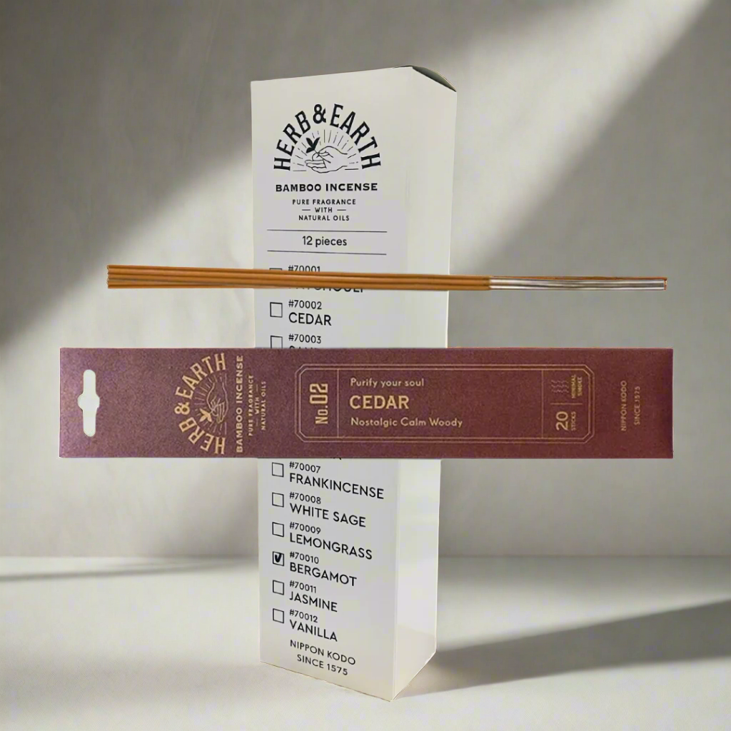 Herb & Earth incense packaging with incense sticks on a white background
