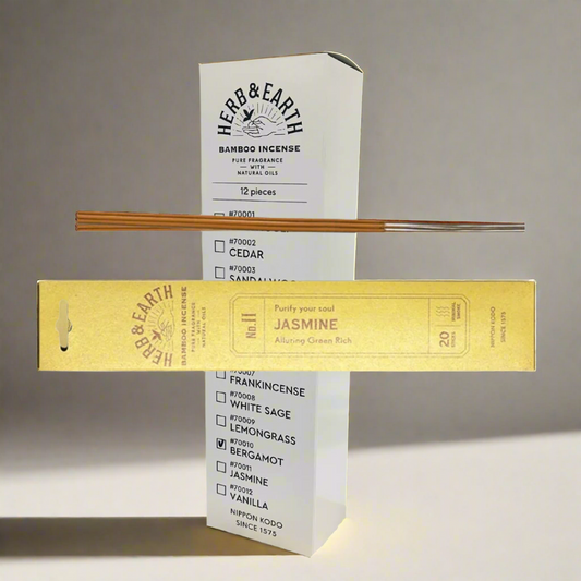 Herb & Earth bamboo incense packaging with incense sticks on a white background