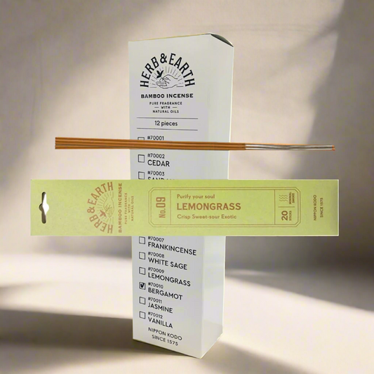 Herb & Earth bamboo incense packaging with incense sticks on a white background