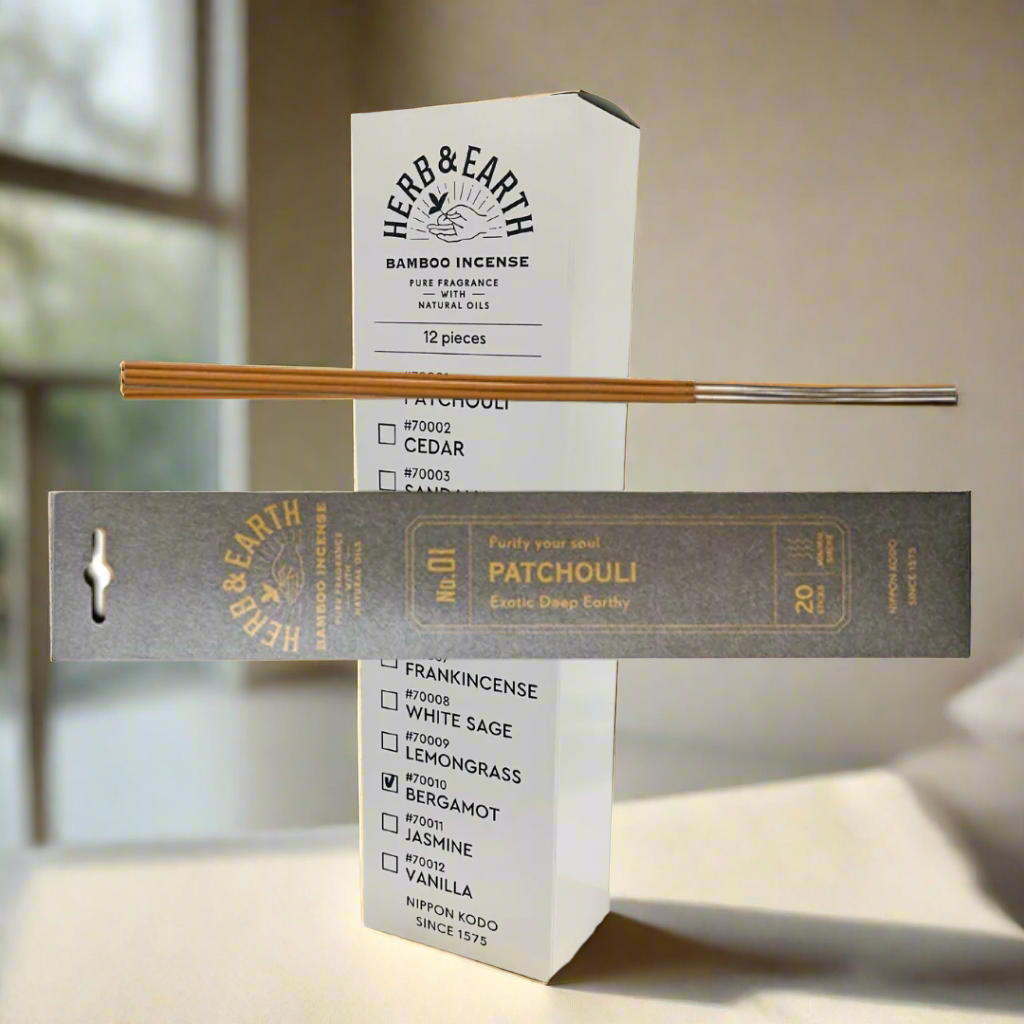 Herb & Earth incense packaging with sticks on a white background