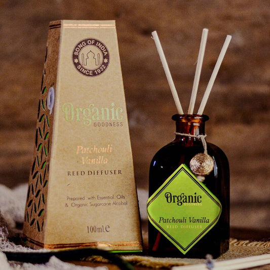 Reed diffuser set with organic label on a wooden background